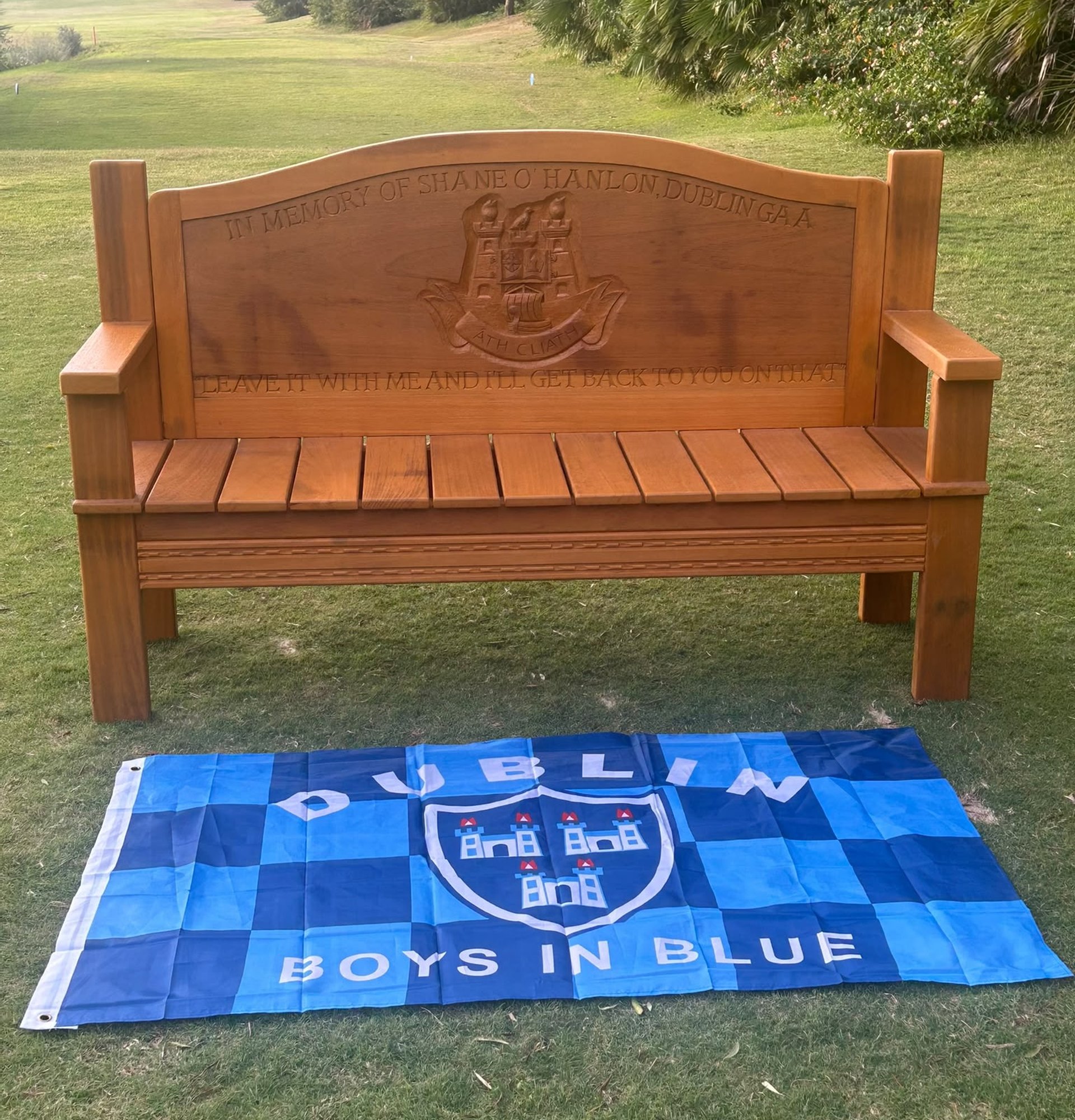 The bench's inscription reads "Leave it with me and I'll get back to you on that." Image