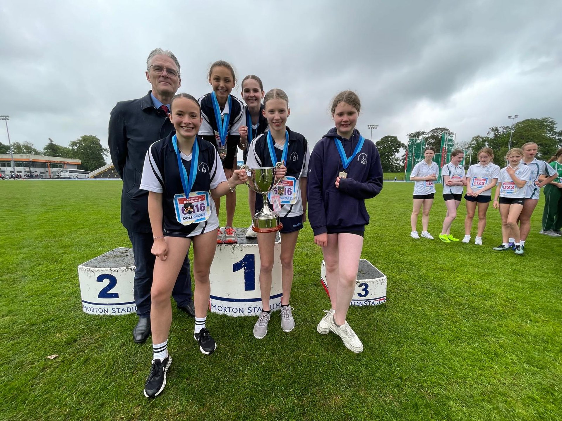 Uachtarán CLG, Jarlath Burns with winning athletes in Morton Stadium, Santry Image