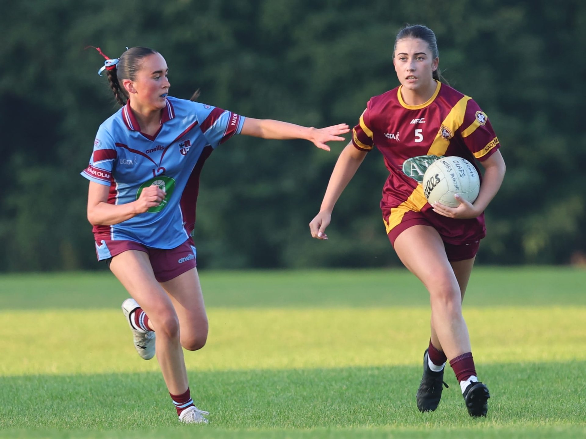 Pictured: Kirsten Finn (Naomh Olaf) and Ellie Hanratty (St Maurs) in action during the PTSB Junior F Championship Final. August 26th. Credit Maurice Grehan.  Image