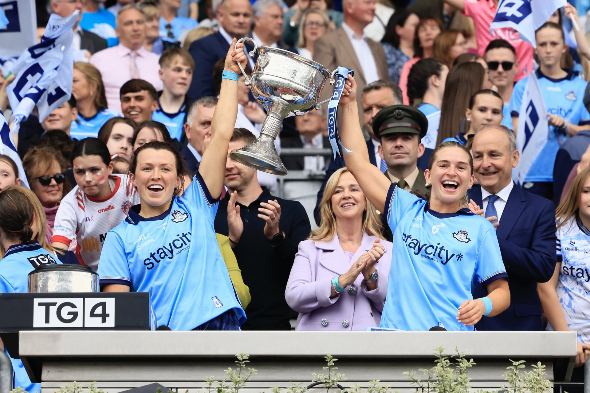 Leah Caffrey & Martha Byrne lift aloft the Brendan Martin cup following Dublin's victory over Meath in the TG4 Senior All Ireland Final. Aug 3rd 2025. Credit Karl Gormley. Image