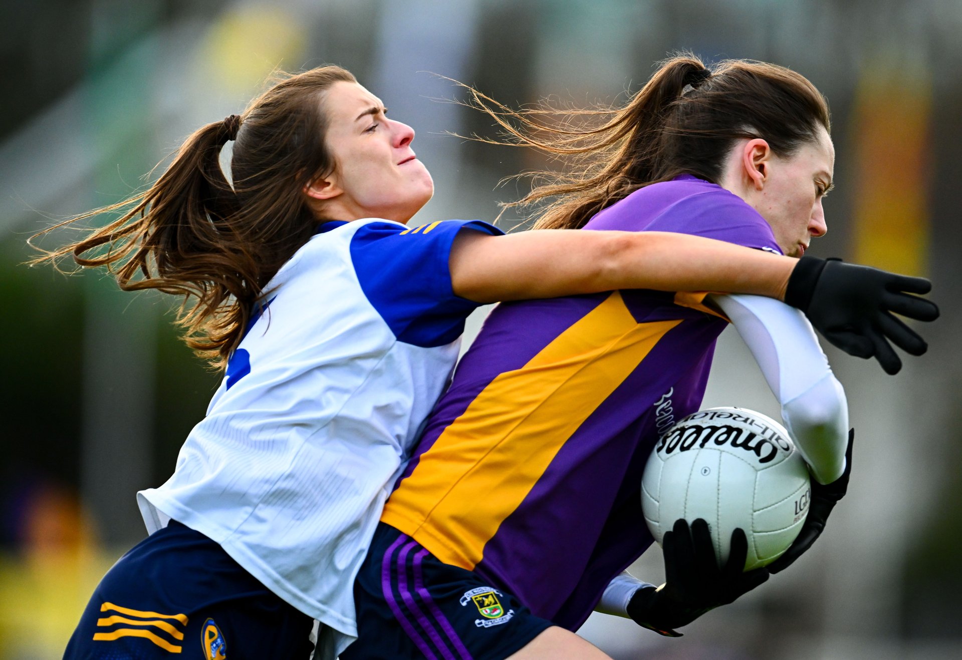 Michelle Davoren of Kilmacud Crokes is tackled by Niamh McIntosh of St Ergnat's, Moneyglass during the 2025 AIB All-Ireland Ladies Football Club Senior Club Championship semi-final match between Kilmacud Crokes of Dublin and St Ergnat’s of Antrim at Páirc de Burca in Stillorgan, Dublin. Photo by Shauna Clinton/Sportsfile Image