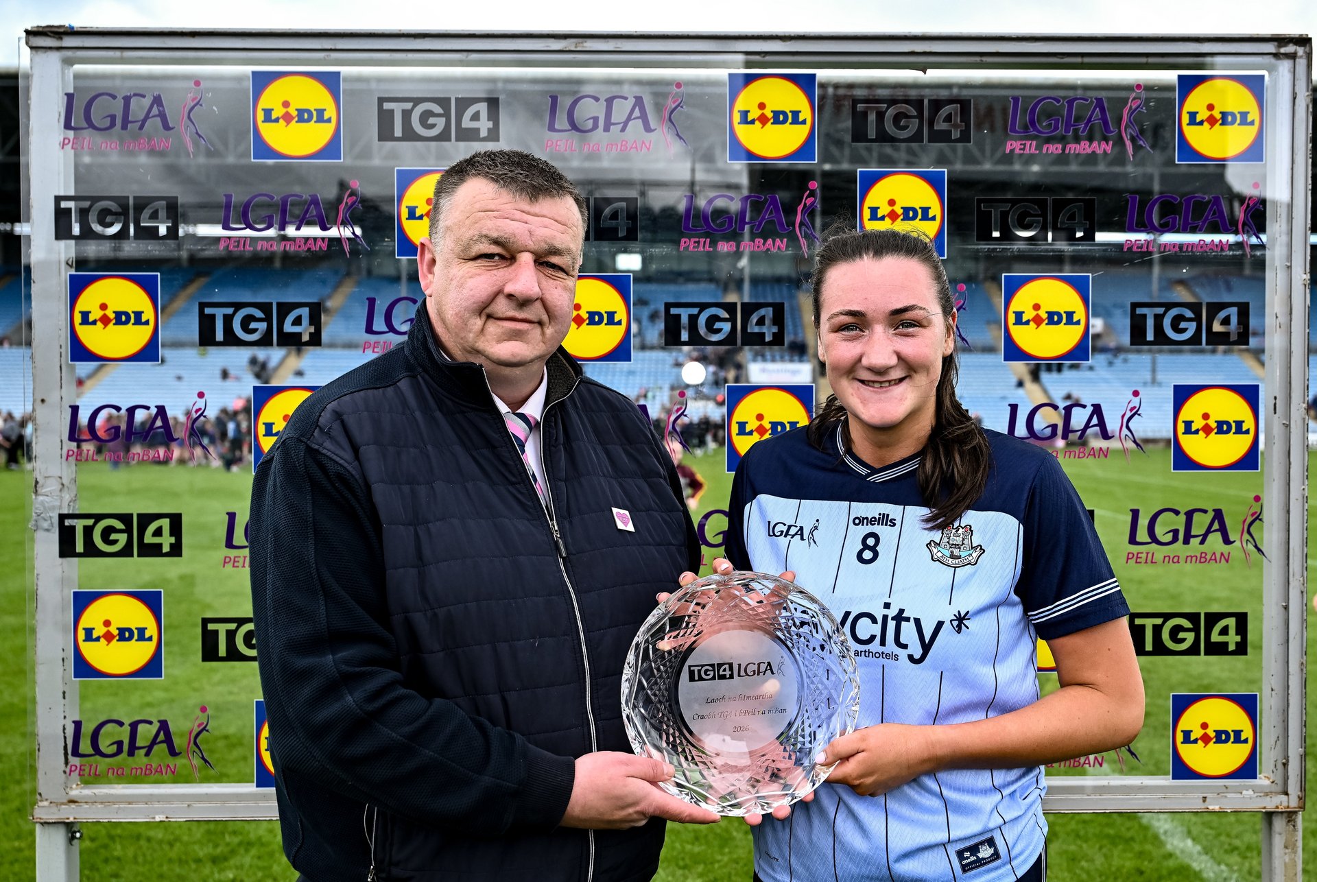 Dublin's Niamh Hetherton (Clontarf) is presented with her Player of the Match award by Keith Gilroy. Image credit Sportsfle  Image