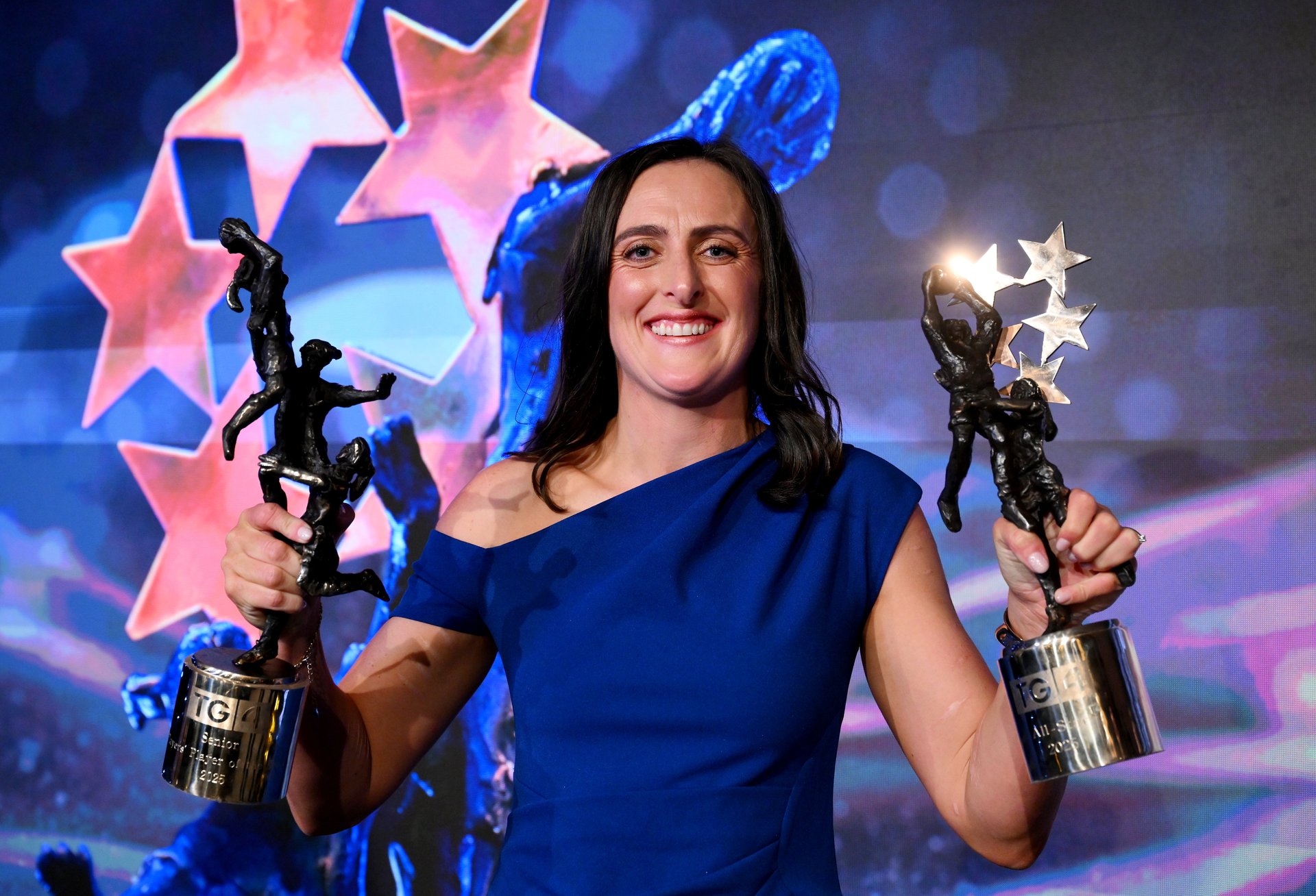 Hannah Tyrrell of Dublin with her 2025 TG4 Ladies Football Senior Players’ Player of the Year award and her All Star award. Credit Sportsfile.  Image